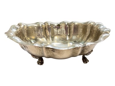 Lot 93 - Continental silver oval dish with scalloped edge and paw feet, stamped 800