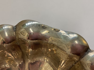 Lot 93 - Continental silver oval dish with scalloped edge and paw feet, stamped 800