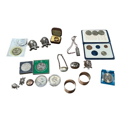 Lot 5179 - Group of silver, including an identity bracelet, ring, ingot on chain, two silver filled Country Artists models of turtles, two other silver models of turtles, and a silver pill box surmounted b...