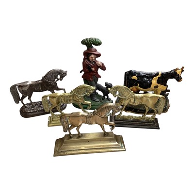 Lot 5173 - Victorian and later three brass horse door stops, three iron door stops