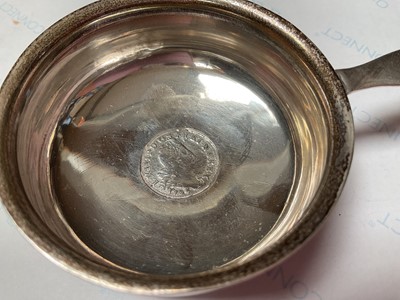 Lot 17 - Georgian silver toddy ladle with a coin inset and a twisted whalebone handle and a glass pepperette with plated mount (2)