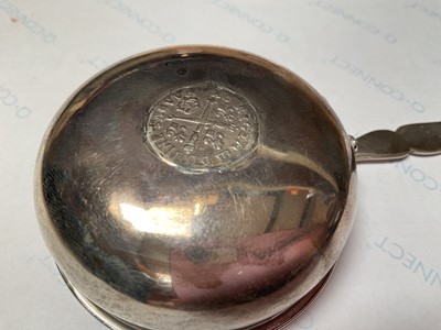 Lot 17 - Georgian silver toddy ladle with a coin inset and a twisted whalebone handle and a glass pepperette with plated mount (2)