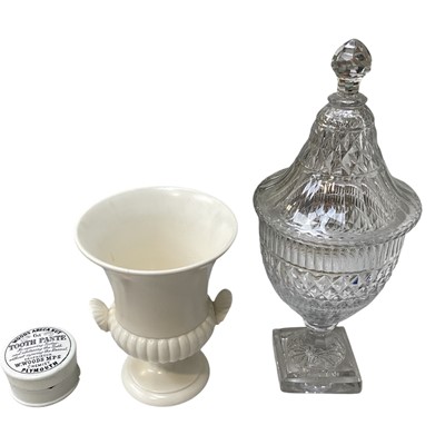 Lot 5251 - Wedgwood white glazed urn, together with a Georgian cut glass sweetmeat urn and cover, and a Woods Areca Nut Tooth Paste pot (3)