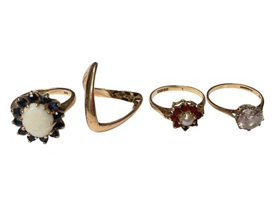 Lot 118 - 9ct gold opal and sapphire cluster ring, 9ct gold synthetic single stone ring, 9ct gold seed pearl and garent flower head cluster ring, 9ct gold v-shaped ring and a black enamel gold plated dres...