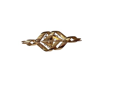 Lot 120 - 9ct gold brooch with a twisted ribbon design set with a central brilliant cut diamond, estimated to weigh approximately 0.10cts.