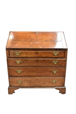 Lot 1425 - George III provincial honey oak bureau
