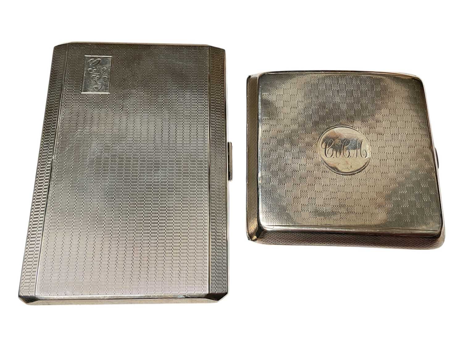 Lot 125 - Two silver cigarette cases, both with engine turned decoration and engraved initials