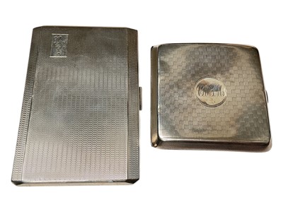 Lot 125 - Two silver cigarette cases, both with engine turned decoration and engraved initials