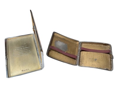 Lot 125 - Two silver cigarette cases, both with engine turned decoration and engraved initials