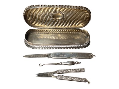 Lot 127 - Victorian silver dressing table box (Birmingham 1894) containing a pair of silver mounted folding sewing scissors, silver mounted penknife and a silver handled button hook
