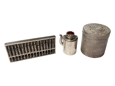 Lot 2 - Chinese silver miniature abacus by Wang Hing, together with a Chinese white metal gem set minituare teapot fitted in a white metal basket with cover (2)