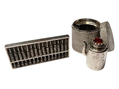 Lot 2 - Chinese silver miniature abacus by Wang Hing, together with a Chinese white metal gem set minituare teapot fitted in a white metal basket with cover (2)