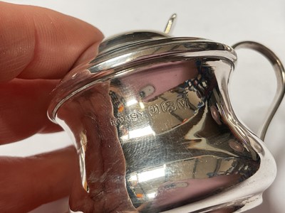 Lot 131 - Silver three piece condiment set with blue glass liners, five various silver salt spoons and a pair of silver pepperettes
