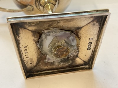 Lot 132 - Edwardian silver cream jug and a 1920s silver two handled trophy with presentation engraving
