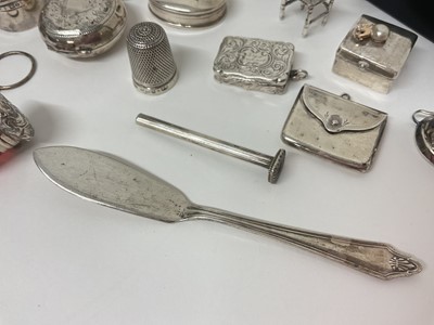 Lot 3 - Group of miniature silver items to include trinket boxes, sovereign case, stamp case in the form of an envelope, Victorian viniagarette, trophies, table and chair ornaments, chamber stick etc, t...