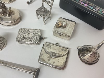 Lot 3 - Group of miniature silver items to include trinket boxes, sovereign case, stamp case in the form of an envelope, Victorian viniagarette, trophies, table and chair ornaments, chamber stick etc, t...