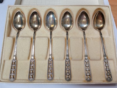 Lot 39 - Set of six David Andersen Norwegian silver coffee spoons with pieced decoration in original box, together with a set of six silver and enamel coffee spoons in case