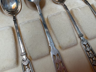 Lot 39 - Set of six David Andersen Norwegian silver coffee spoons with pieced decoration in original box, together with a set of six silver and enamel coffee spoons in case