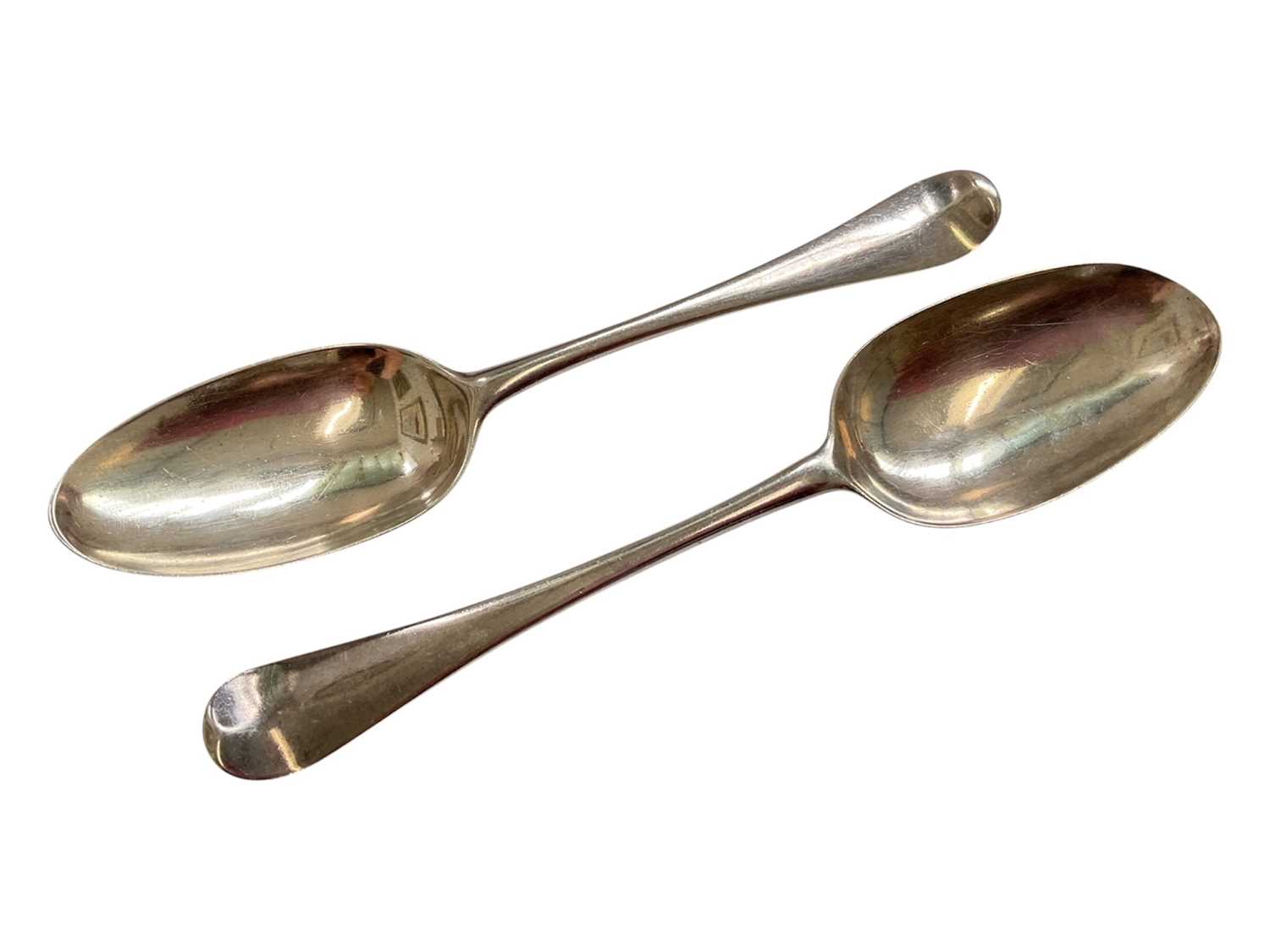 Lot 76 - Pair of Georgian silver Hanoverian pattern tablespoons (London hallmarks rubbed)
