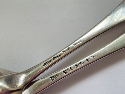 Lot 76 - Pair of Georgian silver Hanoverian pattern tablespoons (London hallmarks rubbed)