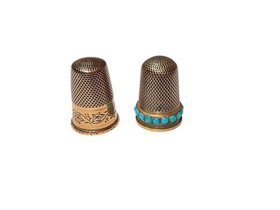 Lot 40 - French gold thimble with engraved ivy leaf decoration and one other yellow metal thimble with a border of turquoise cabochons (2)