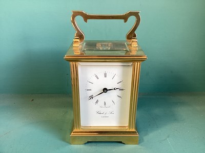 Lot 5277 - Good quality gilt brass carriage clock retailed by Gluck & Son, London