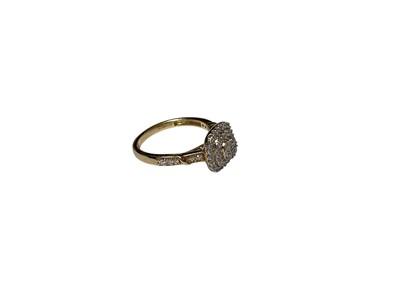 Lot 65 - Diamond cushion shaped cluster ring with three tiers of brilliant cut diamonds and further diamond set shoulders
