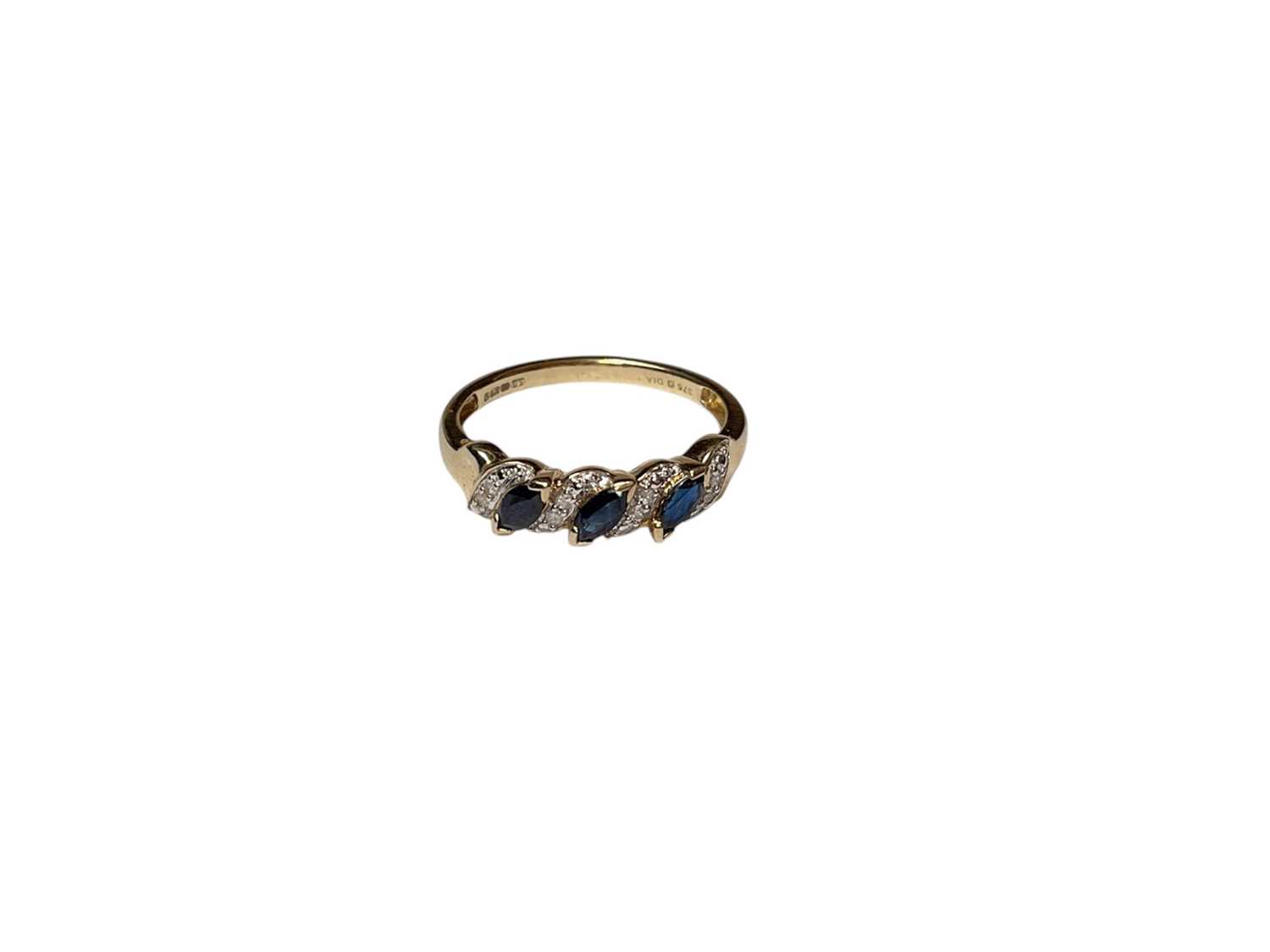 Lot 68 - 9ct gold sapphire and diamond ring with three marquise shaped blue sapphires interspaced with diamonds