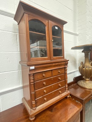 Lot 5401 - Antique miniature two height bookcase with two glazed doors above a chest of drawers, 102cm tall x 60cm wide.