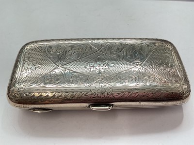 Lot 143 - Edwardian silver cigar case with engraved scroll decoration (Birmingham 1904), together with three silver mounted cigar cutters