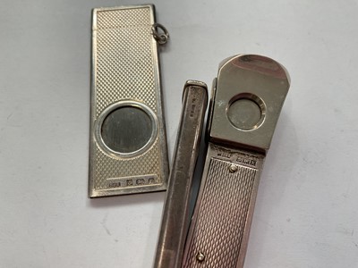 Lot 143 - Edwardian silver cigar case with engraved scroll decoration (Birmingham 1904), together with three silver mounted cigar cutters