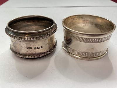Lot 144 - Group of silver to include a pair of salts with three salt spoons in fitted case, two napkin rings, 1940s cup and a 1920s spill vase with weighted base