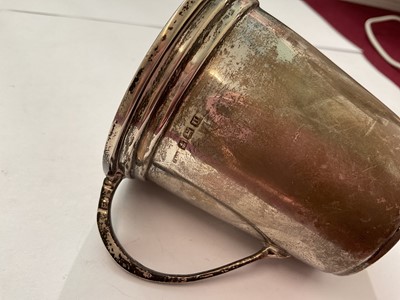 Lot 144 - Group of silver to include a pair of salts with three salt spoons in fitted case, two napkin rings, 1940s cup and a 1920s spill vase with weighted base