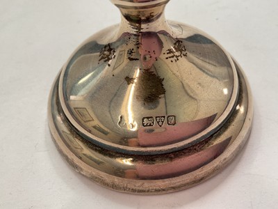 Lot 144 - Group of silver to include a pair of salts with three salt spoons in fitted case, two napkin rings, 1940s cup and a 1920s spill vase with weighted base