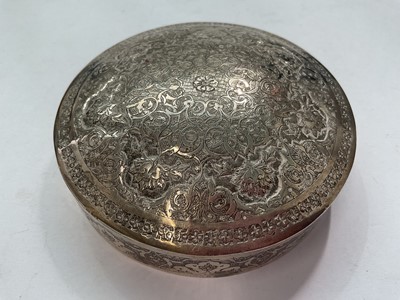 Lot 145 - Eastern white metal pot and cover with enrgaved foliate scroll decoration, Eastern white metal serving spoon, two silver (830) napkin rings, a plated napkin ring and a silver (830) fork
