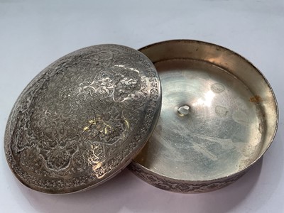Lot 145 - Eastern white metal pot and cover with enrgaved foliate scroll decoration, Eastern white metal serving spoon, two silver (830) napkin rings, a plated napkin ring and a silver (830) fork