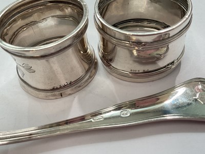 Lot 145 - Eastern white metal pot and cover with enrgaved foliate scroll decoration, Eastern white metal serving spoon, two silver (830) napkin rings, a plated napkin ring and a silver (830) fork