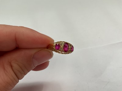 Lot 146 - Antique 18ct gold pink synthetic three stone ring with rose cut diamond accents (Chester 1916)
