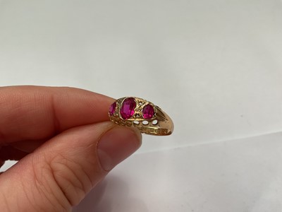 Lot 146 - Antique 18ct gold pink synthetic three stone ring with rose cut diamond accents (Chester 1916)