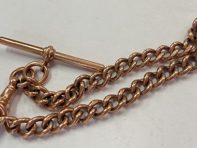 Lot 105 - 9ct rose gold watch chain bracelet (London 1990) with a 9ct gold mounted smoky quartz rotating fob