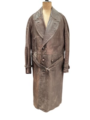 Lot 2556 - Vintage brown leather motoring coat with belt.