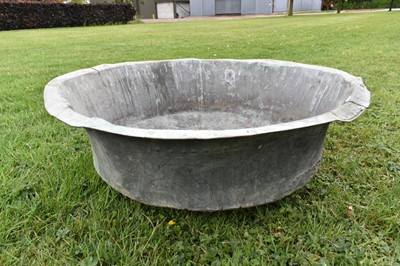 Lot 1344 - Large antique copper vessel / planter of shallow form with riveted construction and verdigris patination, approximately 85cm diameter x 30cm high