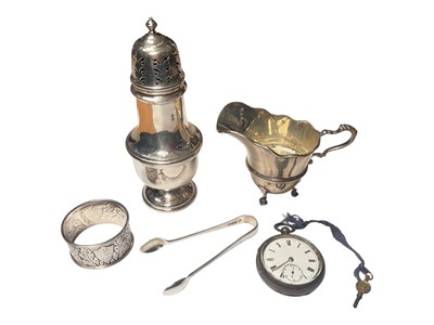 Lot 102 - 1960s silver sugar caster, silver cream jug, Edwardian silver napkin ring, pair of Victorian silver sugar tongs and an Edwardian silver cased pocket watch (5)