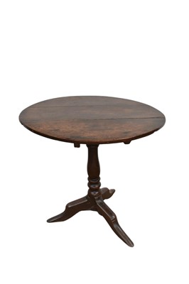 Lot 1351 - 18th century primitive oak occasional table, with circular tilt-top on bulbous column and squat cabriole legs, 74cm wide, 66cm high