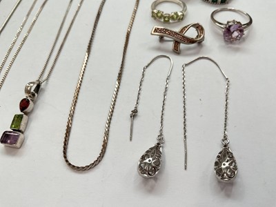 Lot 140 - Small group of silver and white metal jewellery to include gem set dress rings, pendants on chains, a brooch and a pair of drop earrings