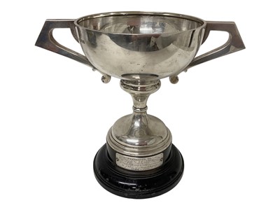 Lot 154 - Large silver two handled trophy (Chester 1911) on an ebonised wood base with an applied white metal presentation plaque