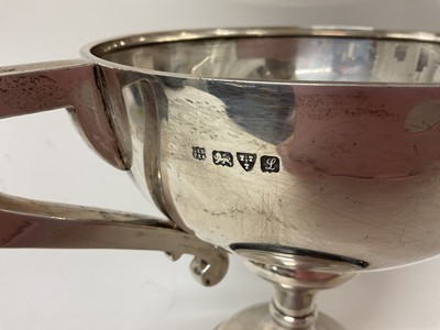 Lot 154 - Large silver two handled trophy (Chester 1911) on an ebonised wood base with an applied white metal presentation plaque