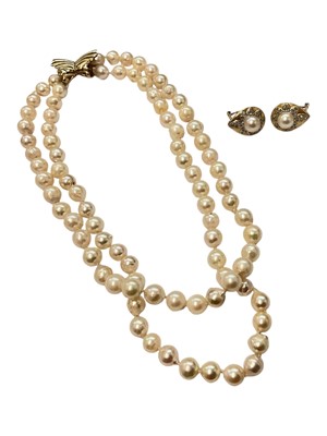 Lot 152 - Cultured pearl two strand necklace with 9ct gold bow shaped clasp and a pair of 14ct gold mounted cultured pearl and diamond earrings