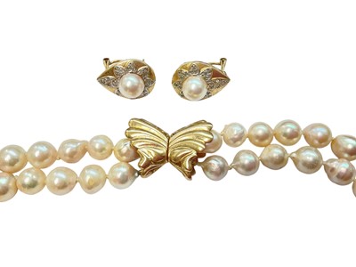 Lot 152 - Cultured pearl two strand necklace with 9ct gold bow shaped clasp and a pair of 14ct gold mounted cultured pearl and diamond earrings