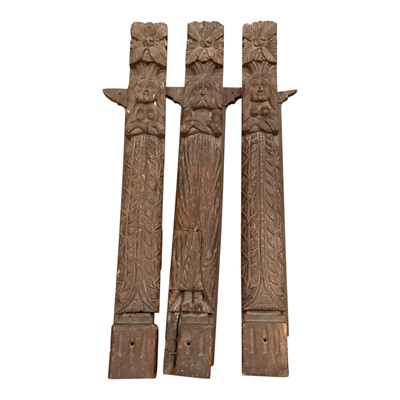 Lot 873 - Three large naive carved oak terms, each 89 x 10cm, 19th century or earlier